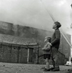 Workmen Drag Gas Cylinders From Mill Blaze (2 of 7)